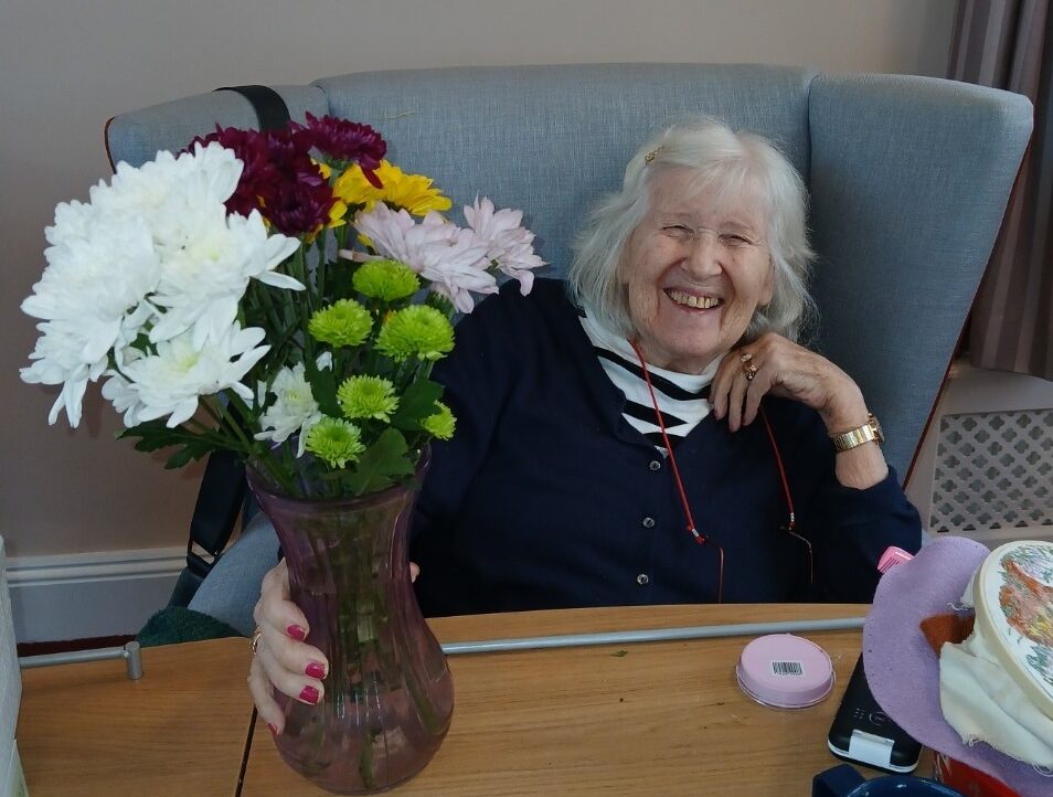 resident with flowers