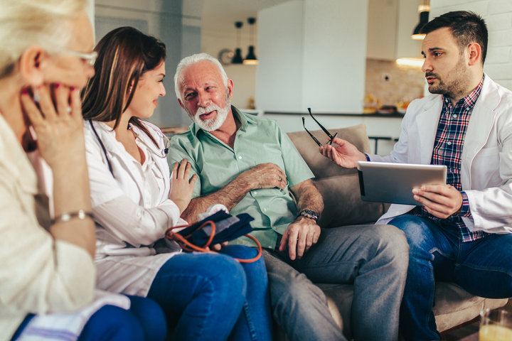 old man and family visiting care home