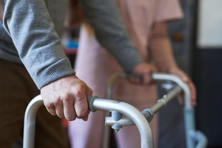 person using zimmer frame