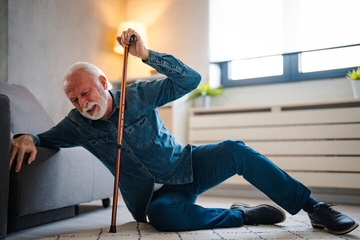 older man falling over at home 